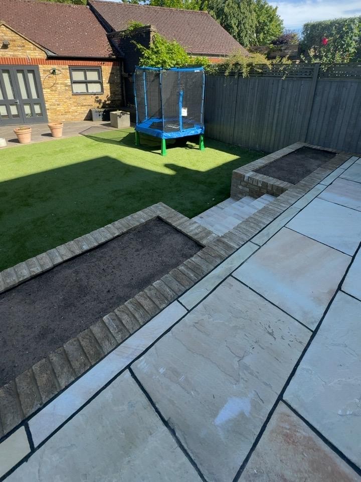 Rear garden terrace paving and raised planting area