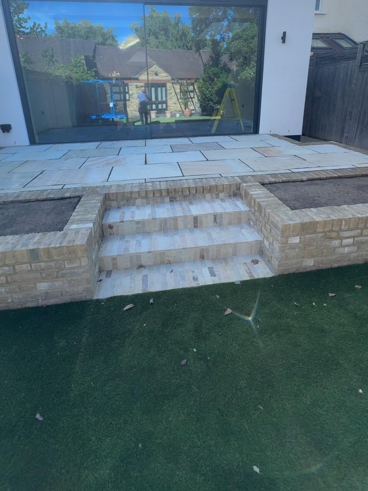 Completed residential terrace steps and raised brick planters