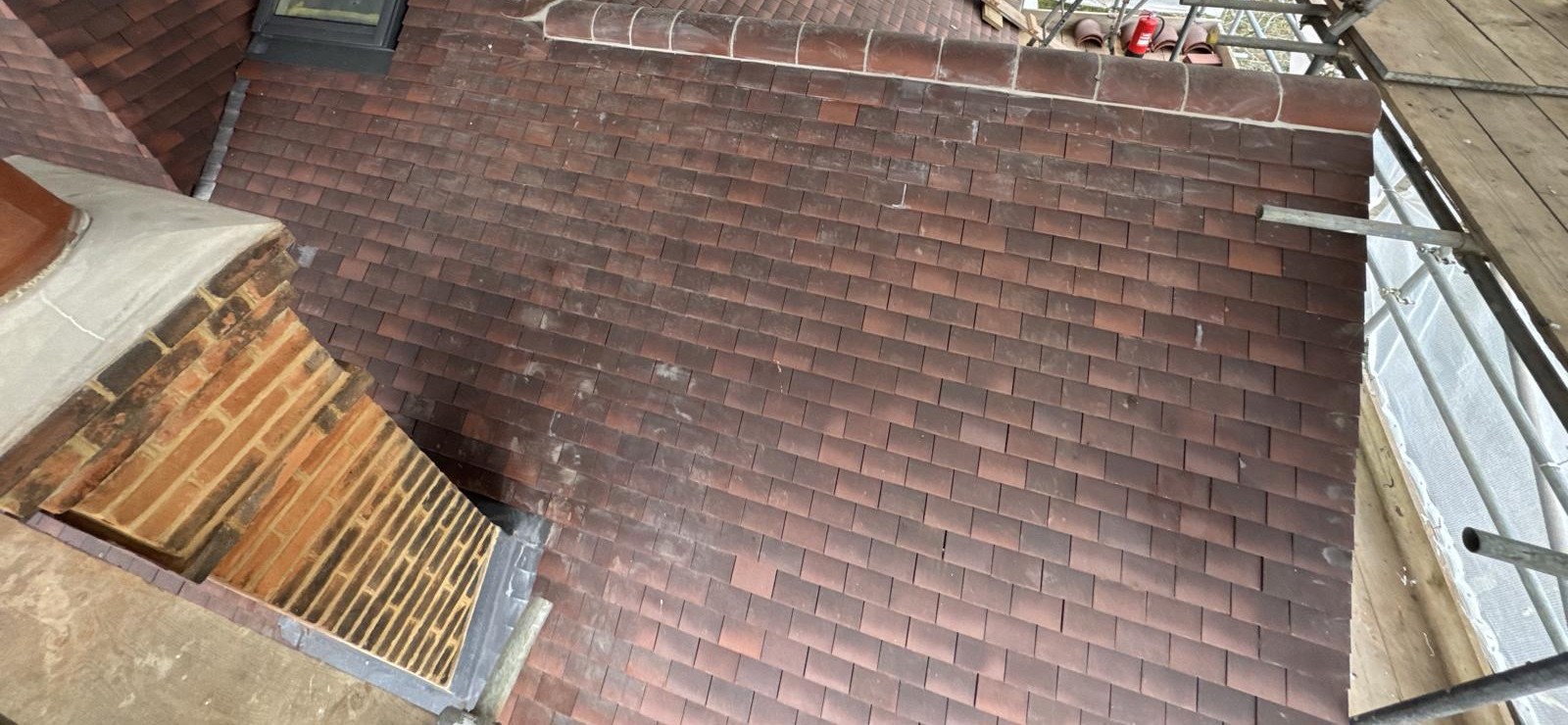 Private residential pitched roof works under scaffold protection
