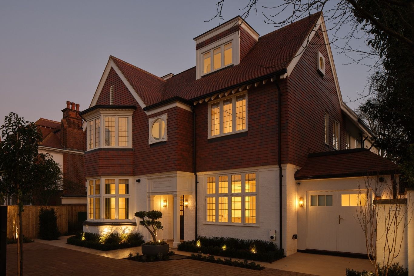 Completed private residential exterior elevation photographed at dusk