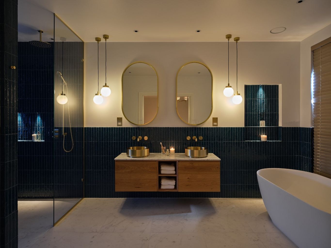 Completed private residential master bathroom with feature tile, double vanity and freestanding bath